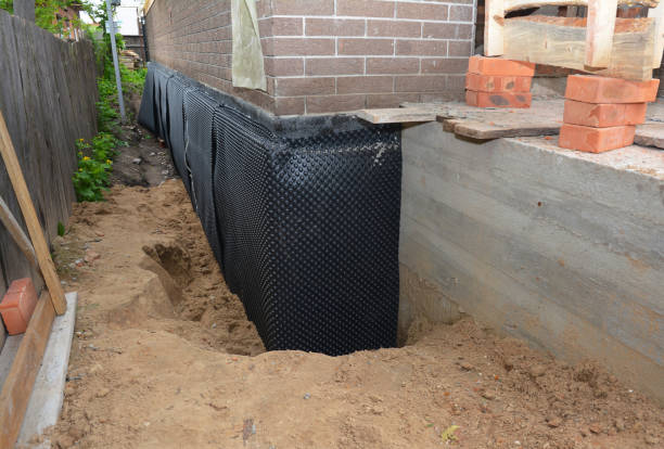 SJ Waterproofing Pros technician performing targeted Exterior Waterproofing assessment in Kent City, MI